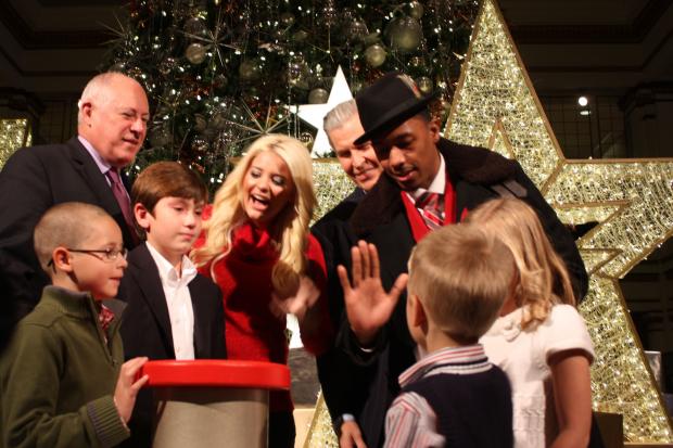  Entertainer Nick Cannon, former American Idol contestant Lauren Alaina and Gov. Pat Quinn were on hand Saturday for the 106th Annual Great Tree Lighting at Macy's State Street. 
