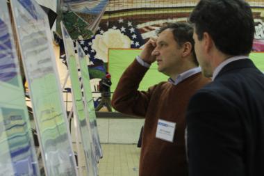  A resident asks questions at an open-house style meeting on the CTA's Ashland express bus proposal Tuesday evening at Benito Juarez Acedemy in Pilsen.  
