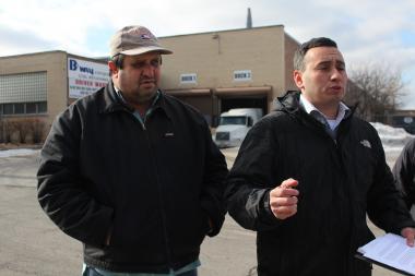  Activist Raul Montes (r.) protests outside BWAY Corp. in Little Village. 
