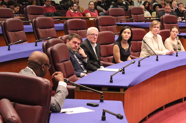  Ald. Willie Cochran (l.) presses Lyft's Candice Taylor (in the black dress) on ride-sharing issues during Thursday's hearing. 
