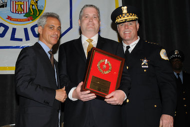  Chicago Police Officer John Pigott (c.) was honored by Police Supt. Garry McCarthy and Mayor Rahm Emanuel. 