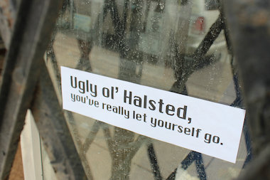  The stickers have been applied to empty storefronts up and down Halsted Streets. 