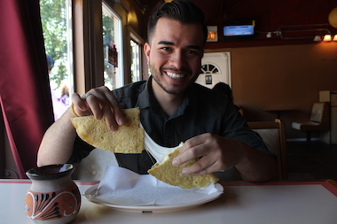  Ambrocio Gonzalez, chef and co-owner at Las Quecas, gets ready to chow down on a quesadilla at his restaurant at 2500 S. Christiana Ave. 