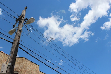  A plane flies over Jefferson Park, one of the neighborhoods complaining about the noise coming from new flight paths since a new runway was opened. 