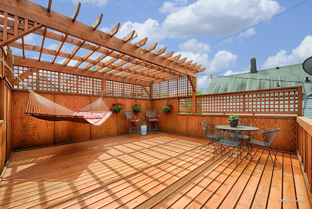   While on a quiet street, the home is an "entertainer's paradise" with its two-tiered deck and wet bar, among other features.  