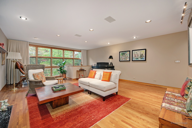   A "perfectly landscaped" yard and window-lined living room are among the features at 2128 N. Racine Ave.  