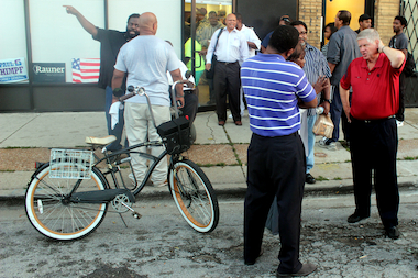  U.S. Senate candidate Jim Oberweis talks with folks outside the new Republican outpost on a stretch of 79th Street in Chicago's 6th Ward. On Thursday, the Republican Party celebrated the opening of three new offices in Chicago. 