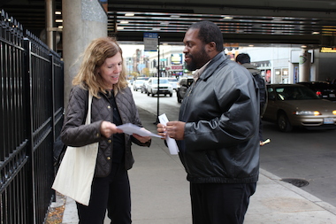  Ellen Hughes hands out flyers near the Belmont "L" station. 