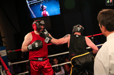  Chicago Teachers Union field representative Joey McDermott takes one in the face for charity at Mercy Home's fight night fundraiser. 