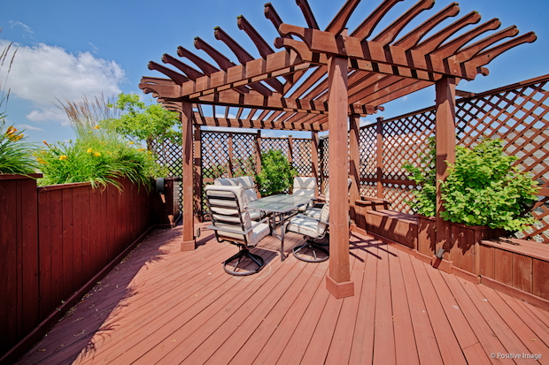   The home at 1938 N. Hudson Ave. has five en-suite bathrooms and a rooftop deck offering city views.  