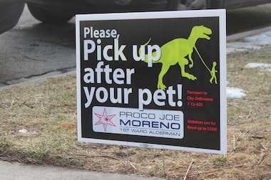  Signs reminding dog owners to pick up waste that also include Ald. Moreno's name are illegal, the city says. 