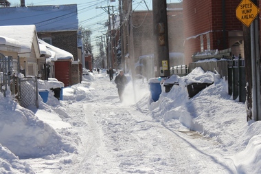  A man plows the alley behind his garage in Bridgeport. 