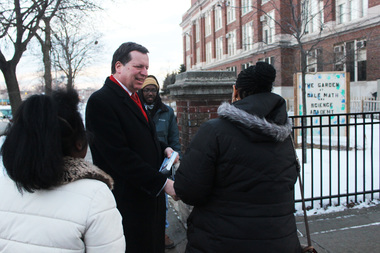  Ald. Joe Moore greets voters and supporters Tuesday before polls closed. 