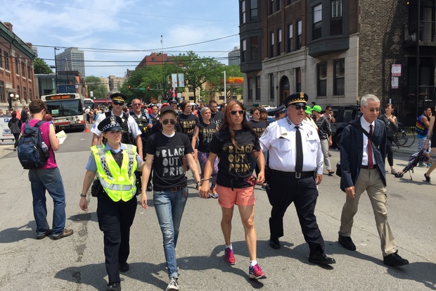  Protesters who staged a #BlackLivesMatter die-in during the Pride Parade are taken from Addison and Halsted in handcuffs to the Town Hall police district, 850 W. Addison St. just before 2 p.m. Sunday. 