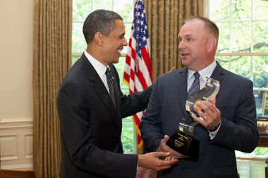  Could Chicago's very own famous South Side President Obama be a Garth Brooks fan at heart? Here the President hands Brooks a 