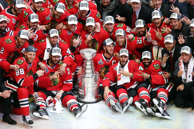  The Chicago Blackhawks pose with the Stanley Cup after defeating the Tampa Bay Lightning by a score of 2-0 in Game Six to win the 2015 NHL Stanley Cup Final at the United Center on June 15, 2015 in Chicago. 