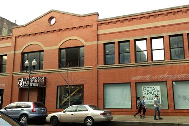  A two-story, 14,750 square-foot building with a back parking lot at 1455 N. Milwaukee Ave.  