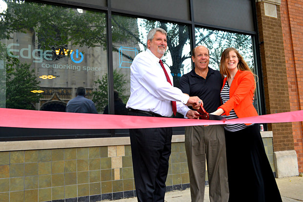  Owner Mike Bartelt, Ald. Harry Osterman and Katrina Balog, executive director of the Edgewater Chamber of Commerce celebrate the grand opening of EdgeWorx during a ribbon-cutting ceremony on Tuesday.  