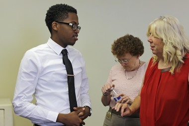  Devin Buckley, 16, talks to Cisco Networking Academy Area Manager Clydene Stangvik. 