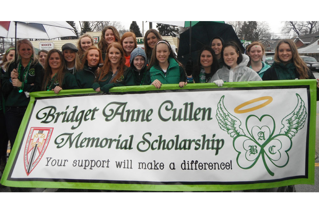 A benefit in memory of Bridget Anne Cullen will be held on New Years Day at 115 Bourbon St. in Merrionette Park. The event will raise money for a scholarship to Mother McAuley Liberal Arts High School in Mount Greenwood. Here, a group of Cullen's friends march with a banner remembering their late friend in the 2013 South Side Irish St. Patrick's Day Parade. 