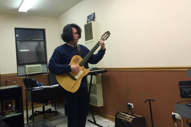  The Guitar Father performs at his studio at 3107 S. Morgan St. 