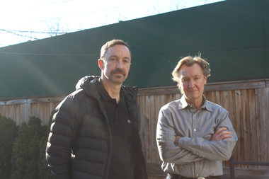  David Kennedy (l.) and Tommy Gawenda are fed up with their next-door neighbor, Dogs Day Inn, 1719 W. Wrightwood Ave. They are seen standing in front of a fence, which separates Gawenda's property from the kennel.  