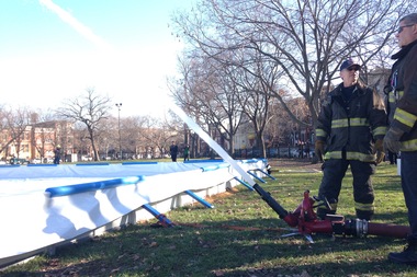  The Chicago Fire Department uses a hose to flood the rink at Wicker Park's ice rink Saturday. 