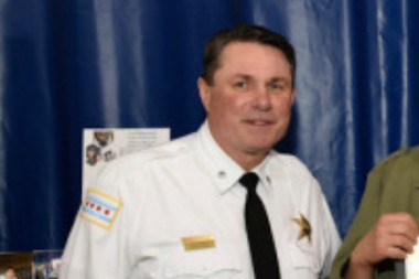  Cmdr. George Devereaux of the Near North Police District 