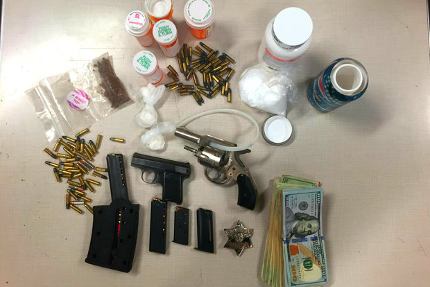  The Chicago Police Department tweeted about the Rogers Park Police District scoring two guns, plus drugs, cash and other illegal items, during a bust late Wednesday night next to district headquarters.  