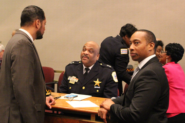  Interim Police Supt. Eddie Johnson talks with Aldermen Anthony Beale (l.) and Greg Mitchell (r.) before Tuesday's committee meeting. 