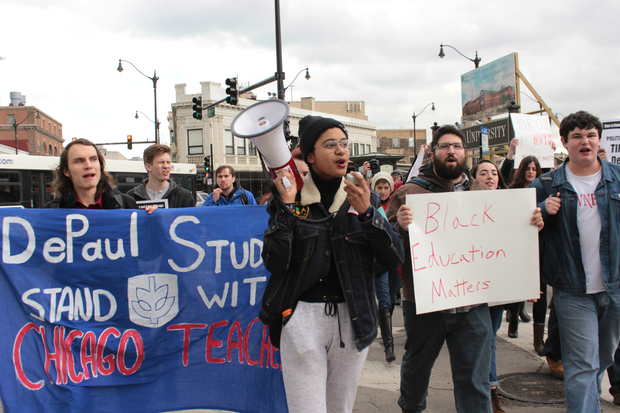  Current and former DePaul University students joined together for a march through Lincoln Park to show support for the Chicago teachers strike Friday. 
