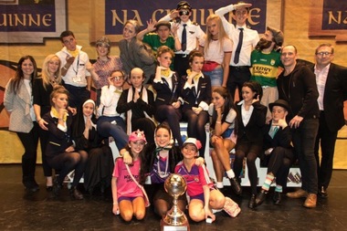  Marist High School senior Stephanie Kohn and her brother Kyle are pictured with their 20-member dance team and coaches after taking first place in the dance drama category at the Irish Dancing Commission’s World Championships. 