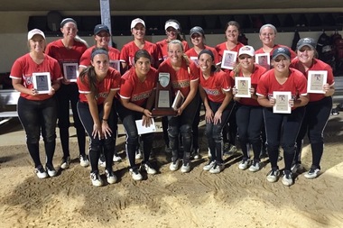  St. Xavier University's softball team holds their runner-up trophies after falling to Oklahoma City University Thursday night in the 2016 NAIA Softball World Series.  