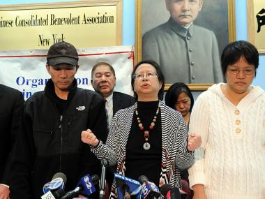 OCA-NY president Elizabeth OuYang (at center), flanked by the parents of Army Pvt. Danny Chen, at a press conference in Chinatown on Thurs., Jan. 5, 2012.