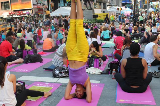  Thousands of yoga enthusiasts took part in a solstice celebration in Times Square on Friday, June 21, 2013. 
