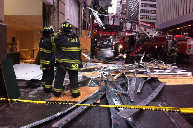  Three people were being treated at the scene after scaffolding collapsed on 40th Street, the FDNY said. 
