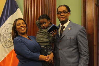  Four-year-old Symeir Talley-Jasper, held in this photo by Public Advocate Letitia James, left his Bed-Stuy school unattended in January. Robert Cornegy, right, introduced a bill in the City Council to outfit school exits with an alarm system. 