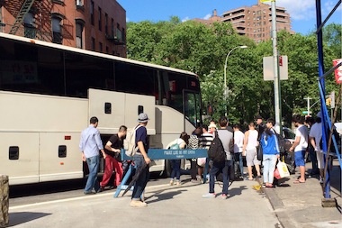  Passengers board an intercity bus on Division Street in June 2014. Community Board 3 will consider a temporary moratorium on new stops for similar buses on Canal Street. 