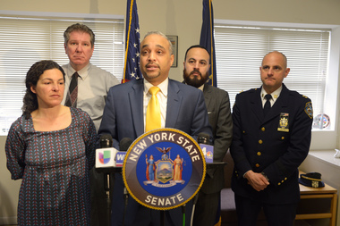  Sen. Jose Peralta, behind podium, joined Assemblyman Michael DenDekker, in the back, to pen a trio of bills aimed at pedestrian safety.  