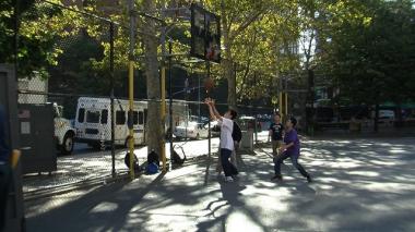 Teens play a game of basketball after school in the Lower East Side on Sept. 25, 2009.