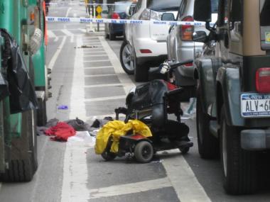 The wreckage of Shami Chaikin's motorized wheelchair after she swerved to avoid a sanitation truck parked in a bike lane on Eighth Avenue.