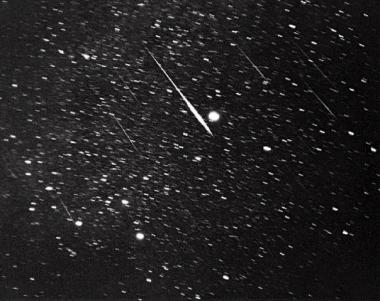 Leonid meteors are shown near Sirius, the bright star near the center, the morning of Nov. 17, 1966. The Leonids occur every year on or about Nov. 18 and stargazers are tempted with a drizzle of 10 or 20 meteors fizzing across the horizon every hour.