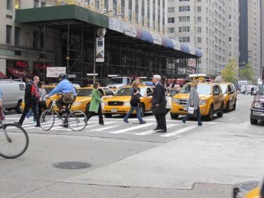 Pedestrians and cyclists cross a busy intersection in mid-town Manhattan in  this photo taken on Nov. 9, 2009.