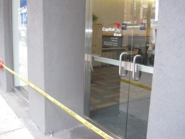 Police tape closed off the Capital One bank at 120 W. 23rd Street Monday after a robbery at the branch.