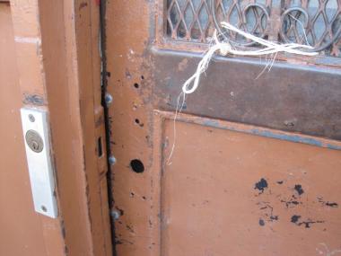 Residents and the building's janitor said Williams was able to get into the building through the front door because of this broken lock.