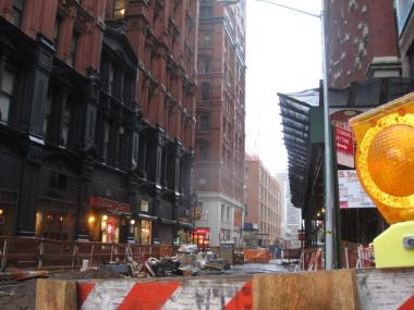 The Office of Emergency Management advised Lower Manhattan residents to remain indoors after debris began falling from a 77-story construction site Monday.