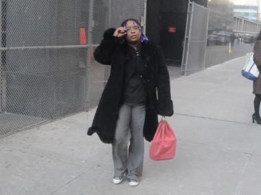 Akwasiba Radellant leaves court after hearing testimony that pot was found in her daycare.