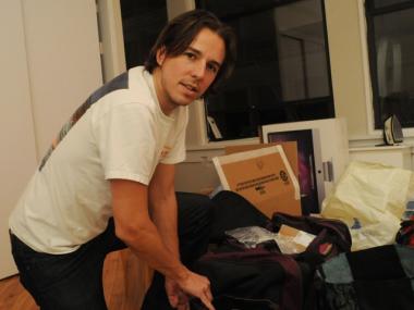 John Seitz in his SoHo apartment packing his medical supplies and gear bound for Haiti.