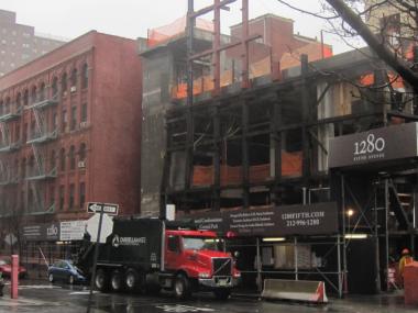 Construction of a new museum is taking place next door to an apartment building on East 110th Street.