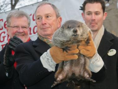 Mayor Michael Bloomberg holds up S.I. Chuck, who predicted an early spring in 2010.